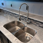 Kitchen undermount double basin sink installation with spring-neck faucet